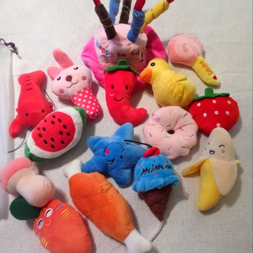 Brand new 12-piece dog/cat sm toys with squeezy noises, comes with colored bows